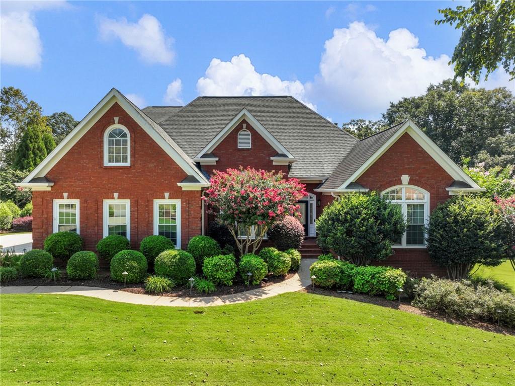 EXQUISITE 4-SIDED BRICK ESTATE HOME NESTLED ON OVER AN ACRE IN A SMALL SUBDIVISION WITH LOW HOA FEES AND ONLY ONE STREET, OFFERING PRIVACY AND EXCLUSIVITY. THE MAIN LEVEL SHOWCASES A SPACIOUS OWNER’S SUITE WITH A SPA-INSPIRED EN SUITE BATH FEATURING A SOAKING TUB AND SEPARATE SHOWER, ALONG WITH TWO ADDITIONAL SECONDARY BEDROOMS. A STUNNING FORMAL DINING ROOM AND AN ELEGANT GREAT ROOM WITH SOARING CEILINGS OVERLOOK THE PICTURESQUE BACKYARD, WHILE THE OPEN-CONCEPT KITCHEN SEAMLESSLY FLOWS INTO THE KEEPING ROOM WITH A COZY FIREPLACE—PERFECT FOR GATHERINGS BOTH LARGE AND SMALL. UPSTAIRS OFFERS AN ADDITIONAL BEDROOM, FULL BATH, AND A VERSATILE FLEX ROOM IDEAL AS A SECOND MASTER SUITE. THE FINISHED TERRACE LEVEL PROVIDES EXCEPTIONAL SPACE FOR MULTI-GENERATIONAL LIVING, COMPLETE WITH A FULL KITCHEN, BATHROOM, GAME ROOM, FLEX ROOMS, AND DIRECT ACCESS TO THE POOL. OUTDOOR LIVING IS AT ITS FINEST WITH A SPARKLING SWIMMING POOL, STONE FIREPLACE, EXPANSIVE DECK, AND PATIO, CREATING A TRUE RETREAT. CAR COLLECTORS WILL APPRECIATE THE SECOND GARAGE IN THE BASEMENT WITH A BOAT DOOR, OFFERING GENEROUS SPACE FOR MULTIPLE VEHICLES. IDEALLY LOCATED JUST MINUTES FROM SHOPPING, DINING, MEDICAL FACILITIES, AND WITH CONVENIENT ACCESS TO I-85 AND I-985, THIS REMARKABLE PROPERTY OFFERS BOTH LUXURY AND LIFESTYLE.
