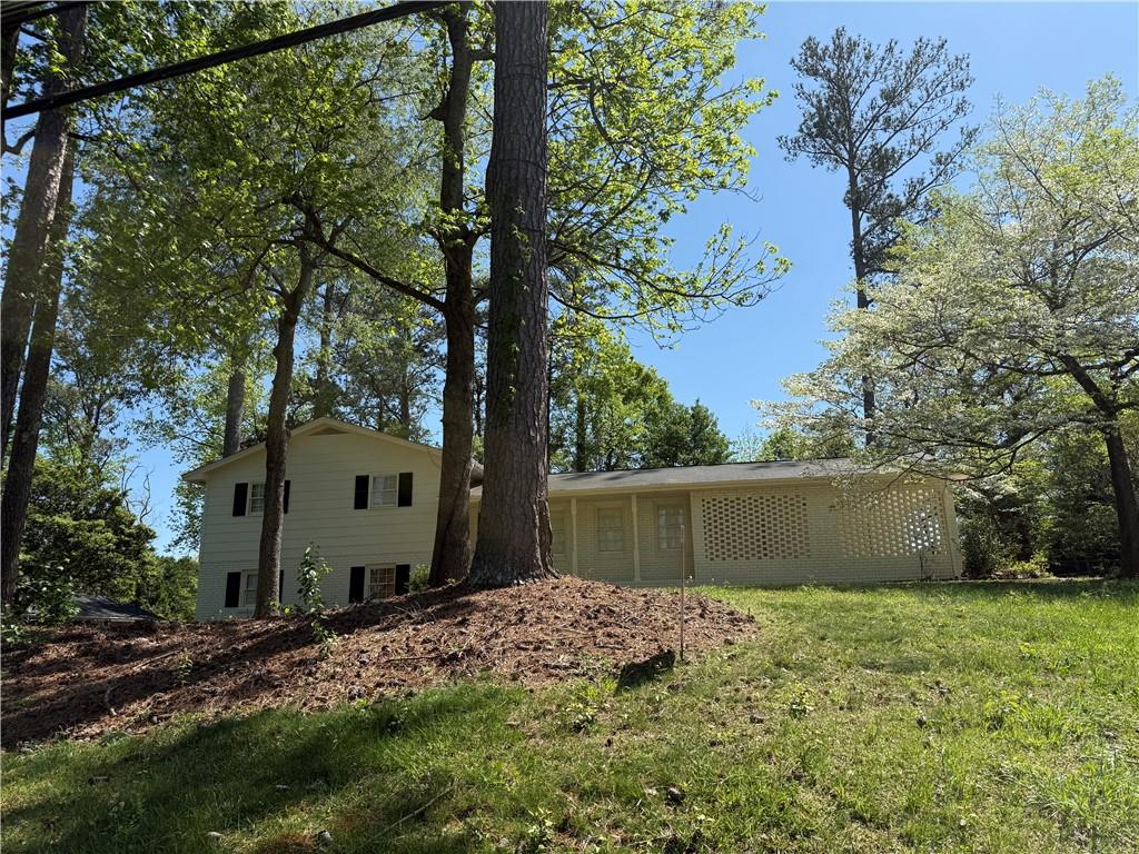 Updated Brick home with lots of square footage in the heart of East Cobb! Move in ready!
New updated paint inside and outside. Split level.
Open floor plan. Large Kitchen with white cabinet , updated granite countertop and tile floors. Electric cooktop. Nice open family room with new polished hardwood floors and lots of windows.
Two bedrooms and two baths upstairs with new polished wood floors, New wood shutters and New ceiling fans. Master bathroom with large walking closet and white vanity and shower.
Full finished basement features One bedroom , full bath with new vanity ,and second family room with fireplace in the basement. Tile floors through out.
Great East Cobb schools! close to shops and restaurants.