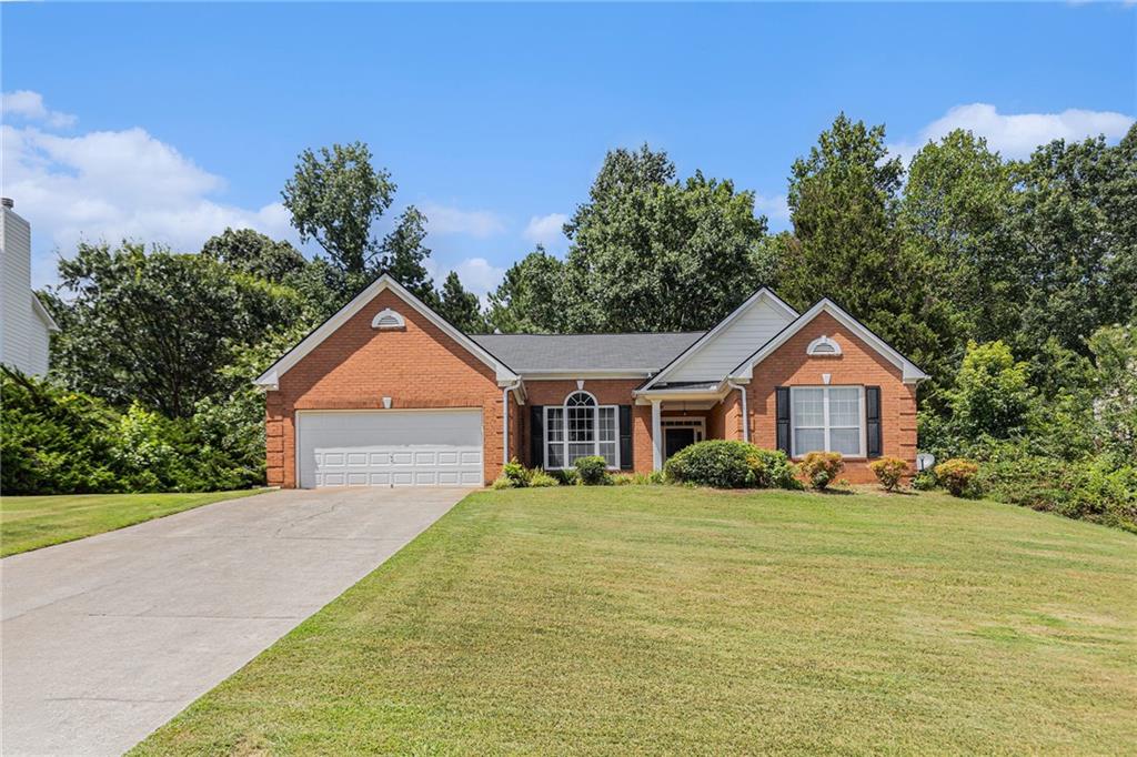 Open floor plan ranch home in quiet, established community! Spacious living room with great hardwood floors with masonry fireplace. Large kitchen with granite countertops and stainless steel appliances overlooks the breakfast area and bar! Enjoy a summer afternoon in the stunning sunroom or private patio! Oversized master with soaring ceilings and private master bathroom with walk in closet! Two secondary bedrooms share a bathroom with private vanities. Easy access to I-20 and close to Villa Rica shopping and dining.