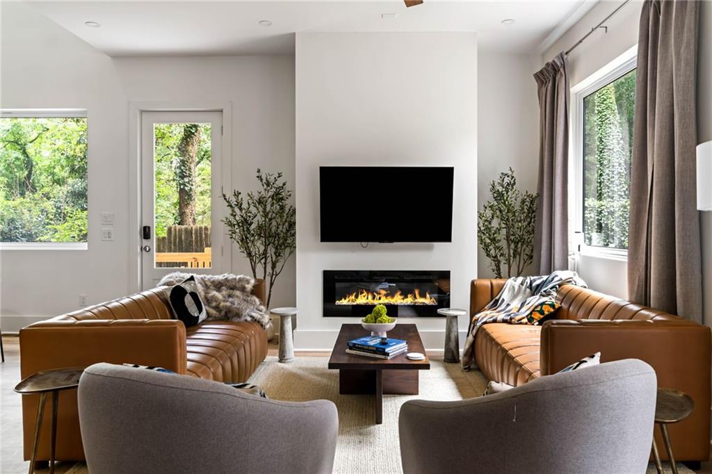 Available for long term, short term, corporate lease, etc. - Fully Furnished! Please inquire about dates requested, duration of stays effects pricing.
Modern Eclectic Treehouse Retreat – Sleeps 14–16 | Walk to Shops
Welcome to your one-of-a-kind modern townhome treehouse escape, where luxury meets playfulness in the heart of Atlanta. Nestled among towering trees that surround the property and stretch their branches over the rooftop patio, this home offers a truly treehouse-like feel with nature woven into the design.
Less than a .5 mile walk to the Edgewood Shops, you’ll have Starbucks, local restaurants, and dozens of shops right at your fingertips—yet feel a world away in this serene, elevated oasis.
Perfect for large groups, families, or friends, the home comfortably sleeps 14–16 guests across 6 spacious bedrooms. Whether you’re relaxing or entertaining, this home is designed to deliver an unforgettable stay.
Enjoy a wide range of premium amenities, including:
1) Stunning Rooftop Patio (half-covered, half-open) with hammock, cornhole, outdoor TV, and cozy lounge seating—all set against a backdrop of lush trees.
2) Private hot tub, ???? firepit, and grilling station for outdoor enjoyment.
3) Fully stocked entertainment kitchen ideal for group meals (Airfryer, Blenders, toasters, coffee / espresso station, etc.).
4) Game room featuring foosball , air hockey, and a PS5 with gaming chairs.
5) Billiards room with a full-size pool table.
6) Dedicated work stations, ideal for remote work or focus time.
7) Gym equipment with a Peloton and free weights for wellness on the go.
Inside, the home offers ultra-fast fiber internet, 4K smart TVs, blackout blinds, board games, and plenty of fresh linens and towels to ensure a seamless and comfortable experience.
Families are especially welcome! The home includes playsets and kid-friendly amenities to make traveling with little ones easy and enjoyable.
Every inch of the home reflects a unique and artistic design, from custom bathroom tiles to thoughtfully curated interiors that create an atmosphere you won’t find anywhere else.
Parking
- 2 car garage
- 1 space in front of garage as well
- Any additional cars would be street parking
House Rules & Policies
Accurate guest count is required per Airbnb and insurance policies (includes overnight guests and day visitors).
No wild parties allowed at all. Small events are allowed with prior approvals!
No smoking, vaping, or hookahs allowed inside on the property. A $750 cleaning fee applies for violations.
No professional photography or filming without prior written approval.
Whether you're visiting Atlanta for a family gathering, a relaxing retreat, or a getaway with friends, this modern treehouse offers the perfect blend of nature, luxury, and entertainment — all in a prime, walkable location.
We’d love to host you and share this special space. Come relax, recharge, and make unforgettable memories at our modern treehouse retreat.