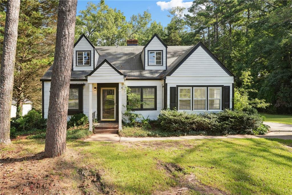 Charming 4 Bed 2 Bath Cottage home with no HOA sitting on 1 acre private lot. Fresh paint and hardwood throughout the home, new floor in laundry room. Enjoy the open-concept living/dining room area with a bonus sun room with amazing natural light. Three guest bedrooms on the main floor with guest bath. The second floor boasts a newer oversized primary bedroom with an ensuite bathroom. The 1-acre leveled backyard is perfect for entertaining. The home also features an unfinished basement and a side carport. Home is in the heart of Hampton, minutes away from the EchoPark Speedway formerly known as Motor Speedway, downtown Hampton, retail shops and restaurants!