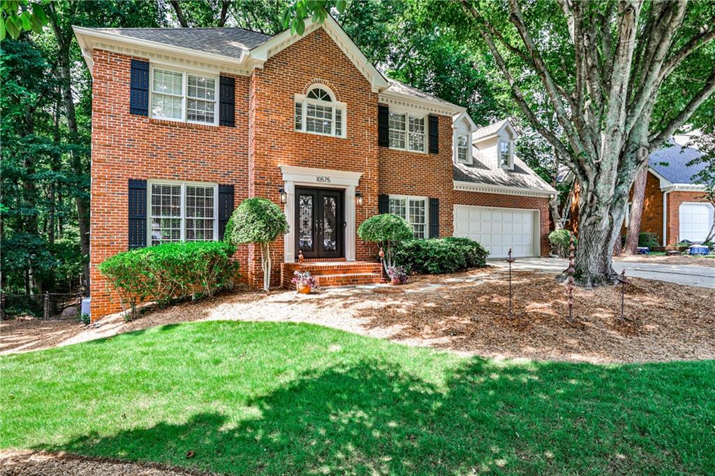This artist-owned-home is an oasis of relaxation and move-in ready! Elegant iron double doors into the front foyer have glass panels that can be opened to the inside. Main floor bedroom with attached full bath give options for office, library or stepless guest suite. Bright kitchen includes new built-in oven & microwave, bar counter seating and attached breakfast room. Slide-out baskets in pantry. Abundant entertaining space in the vaulted family room with fireplace, wet bar & French doors leading to rear deck--perfect for watching the visiting deer & a variety of birds! A separate living & dining room rounds out the main level, to include a laundry room with sink and additional storage nook. New carpet leads to upstairs primary suite w/double walk-in closets & updated bath has oversized shower including traditional wall & overhead rain showerheads. Relax in the jetted tub while looking out to the serene, wooded backyard. An updated hall bath is adjacent to 2 additional bedrooms, each has walk-in closets w/custom built-ins. A Zen-like Bonus room invites you to cultivate your well-being as a perfect space for yoga, meditation or library. Two window seats with storage below & a flat-panel electric fireplace. Rear stairs with balcony view to the family room just outside the door. High-end design elements on the terrace level with numerous automated lighting systems highlight the gallery space. There's a custom-designed home theater with built-in surround sound ready to host movie nights and sporting events in style. The adjacent full bath carries parallel TV & sound from the theater for uninterrupted enjoyment by all. Office on this level provides a one-of-a-kind backdrop for any work-from-home videoconference with the art gallery wall. Owner currently has a full-functioning pottery studio on this level, with high-voltage wiring available; ample space ready to convert to the workshop you have dreamed of! Plenty of additional storage in unfinished utility room. HVAC system includes whole-house dehumidifier & multiple zoned thermostats. Reverse osmosis filtration system and new 50-gallon water heater. Very private lot with custom-built footbridge in back, beyond fenced area. Tuxford is an active swim/tennis community with social events and new clubhouse. Just minutes from GA400, Avalon, downtown Alpharetta and some of the top public schools in the state. Come see this well-maintained gem for yourself!