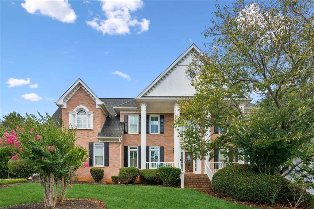 This spacious 5-bedroom, 3 full and 2 half-bath home is located in the desirable Trotters Ridge subdivision in Snellville. Set on a well-landscaped lot with an expansive, level backyard, it’s perfect for outdoor activities and entertaining. Upon entry, a dramatic two-story foyer welcomes you, with a private office featuring French doors to the right and a formal dining room to the left. Rich hardwood floors flow throughout the main level, which includes a family room with coffered ceilings and a marble fireplace that opens to a screened-in patio with ceiling fans, bead board ceiling, and porcelain exterior flooring. The chef’s kitchen boasts a large center island, butler’s pantry, gas cooktop, double ovens, breakfast bar, and recessed lighting. Off the kitchen, a vaulted sunroom with built-in bench seating offers a bright, inviting space. Outdoor living spaces include a deck and a covered patio with an outdoor fireplace, ideal for year-round entertaining. Upstairs, the primary suite features a vaulted ceiling, double vanities, a jacuzzi tub, a large walk-in closet, and a custom tiled shower with dual shower heads, bench seating, and a built-in niche. Three additional bedrooms offer walk-in closets and share two Jack-and-Jill bathrooms. A fifth upper-level room, currently used as a custom walk-in closet, can easily be converted back into a bedroom. The basement offers excellent potential for customization and is priced to reflect necessary updates. This property presents a wonderful opportunity to personalize your dream home in a sought-after community. Book your showing today!