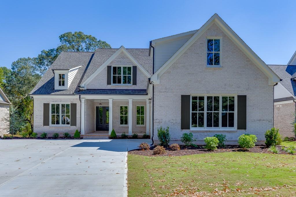 The Charlotte plan by Tipton offers an outstanding living experience in the highly desirable Buford City School District. This 5 Bed/4.5 Bath home boasts quality craftsmanship, stylish finishes, and an open concept layout. Enter to 10' ceilings on main, a chef-inspired kitchen, complete with a large quartz island, walk-in pantry, upgraded stainless steel appliance package-all overlooking the open breakfast area and the expansive family room with built-in shelving and beams. Separate Dining Room/Flex Room. Additionally, complimenting the main level, mudroom & lockers off the garage next to the laundry room equipped with sink. Oversized Owner’s suite on main includes relaxing spa-style bath with frameless glass shower, free standing soaking tub, quartz vanity and expansive walk-in closet. Spacious guest bedroom on main w/ attached ensuite and grand walk-in closet. Upper level leads to 3 generously sized bedrooms, 2 bathrooms, a media room, second level laundry room and additional storage space. The unfinished basement provides even more space for your personalized touches with unlimited potential. Large, covered deck with outdoor fireplace overlooks private back yard situated on .45 acre lot. Home is conveniently located near top rated Buford City Schools, easy access to downtown Buford dining, shopping, entertainment, parks, Lake Lanier and more!