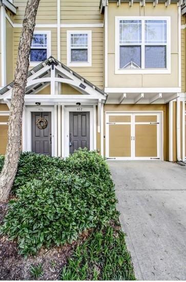 This hidden treasure is your opportunity to live in Grant Park. The Village at Grant Park is a secluded, quaint, private 33-unit gated community south of historic Grant Park. The two bedrooms on the second floor each have a full bathroom. This is the perfect roommate layout. The master bedroom has custom wainscotting. The main living area has an open floor plan. Natural light floods the living room making it a cheerful spot to gather. The kitchen has solid surface countertops and an ample breakfast bar. Custom wainscotting adorns the dining room for a more formal feel. From the dining room, you can step outside to your peaceful deck. A perfect spot to enjoy a cup of coffee in the morning or indulge in a happy hour cocktail while you unwind from the day and take in the quiet. The garage level has a third bedroom or flex room with a half bath. An excellent spot for a home office. Directly off of this room is a private, fenced backyard. The one-car garage has room for storage and a washer and dryer. The community has a shared grilling area with two grills, a community garden, and a pool. What a place to entertain. From Unit 402 you can easily walk to Eventide Brewing, the Beacon, Atlanta Beltline, and Zoo Atlanta. PLUS easy access to 20 & 75/85. This is truly the place to soak up intown living.