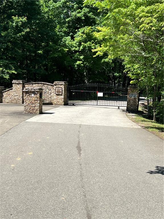 Welcome to the Oaklands in Talking Rock! This beautiful five-acre lot located on a cul de sac, offering a perfect balance of seclusion and convenience. You'll be just minutes away from downtown Jasper and Talking Rock while still enjoying a tranquil oasis in the heart of the North Georgia Mountains. The location is convenient to all of North Georgia, just hop on Hwy. 515 and head north for more mountains and activities. With a beautiful and peaceful location, it is perfect for nature lovers. Don't miss your chance to own this incredible piece of property. Whether you're looking for an investment or a place to call home, this 5-acre lot in the Oaklands is a must-see.