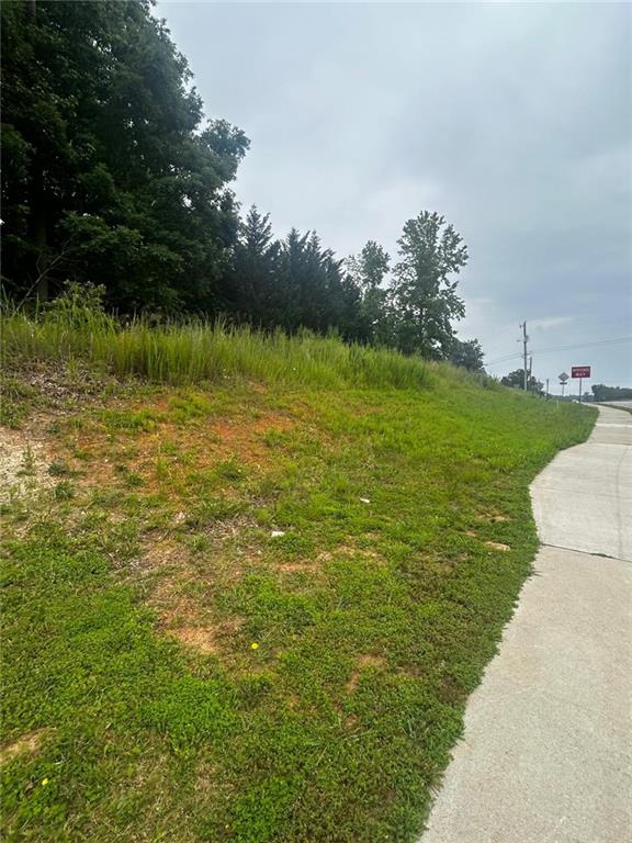 Unique investment opportunity on 6315 Spout Springs Road, Flowery Branch, GA 30542 — this prime lot is perfectly positioned in a high-growth corridor surrounded by ongoing commercial and residential developments. With excellent road frontage and high traffic visibility, it offers incredible potential for future retail, mixed-use, or long-term investment. Additionally, the property allows you to build your dream home or place a mobile home, offering even more flexibility for residential or income-producing use. Land in this location is becoming increasingly scarce, making this a rare chance to secure a valuable piece of rapidly appreciating real estate.