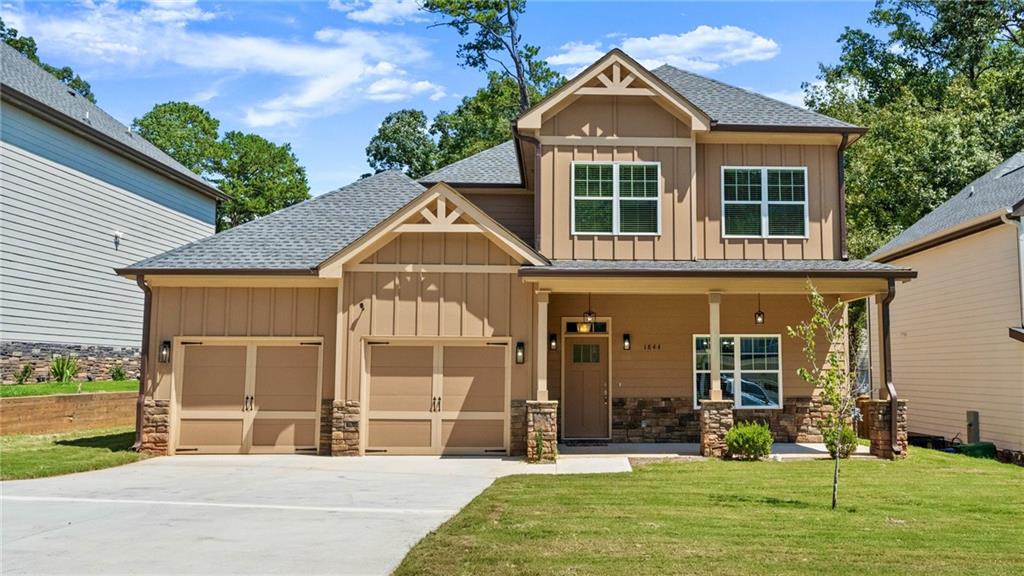 Discover a life of ease and comfort at 1844 Treymire Court, Stone Mountain, GA. This almost-new, barely lived-in home offers an inviting open concept design that makes every day feel welcome and refreshing. The very spacious layout is perfect for entertaining guests, working from home and enjoying quiet moments alone, with thoughtful touches that enhance your daily living experience. Imagine cooking in a sleek, modern kitchen that opens to a fireside living area where you can connect with family and friends, creating memories in a space designed for togetherness and joy. An expansive kitchen peninsula is the perfect gathering spot for family and guests - the heart of the home. A cozy living area invites is the perfect conversation or binging Netflix space. The blend of luxury vinyl and carpet flooring throughout the home adds both style and practicality, crafted for your everyday comfort. Three bedrooms upstairs allows peaceful separation between day-to-day life and evening relaxation. Step outside to your own outdoor space in the cozy backyard, an oasis for relaxation. Or hang out on the front patio and chat with your neighbors. Living here means being part of a vibrant community that offers a wonderful backdrop to your life. Sellers have loved the sense of space and the welcoming nature of this home. Make 1844 Treymire Court your sanctuary, where every day is as comfortable as it is joyful.