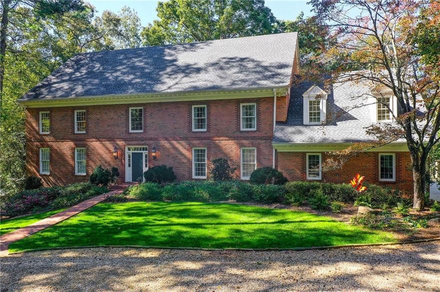 Welcome to 1710 Winterthur Close an exceptional estate on the banks of the Chattahoochee River in the prestigious Winterthur community. Nestled on 2.39 private acres, this beautifully renovated brick traditional combines timeless architecture with modern luxury. Drive up to this level, beautifully landscaped lot where a graceful circular driveway and impeccable curb appeal set the tone for the elegance that awaits inside. Offering 7 bedrooms and 5 full bathrooms, this home provides expansive spaces for both elegant entertaining and comfortable everyday living. The main Level living includes a beautiful  kitchen and keeping rom with custom tongue-and-groove ceilings with beams.  This chef's  kitchen  features quartz  countertops, custom cabinetry, an 8 foot  island, top-of-the-line Wolf, Sub-Zero and Cove appliances. Kitchen opens to a keeping room which has floor to ceiling windows and a custom built-in bar and entertainment area, perfect for gatherings. The main level  living has hardwood flooring and a beautiful vaulted fireside living room, a banquet-size dining room, and a charming sunroom with brick flooring and floor-to-ceiling windows overlooking the backyard and Chattahoochee River. The primary suite on the main level includes double closets, a dressing room and a spacious bath. The main level also has a convenient mudroom/laundry room from the walk in garage and  a guest full bathroom.  Upstairs are four additional spacious bedrooms with great closets, including two en-suite bedrooms, along with an office/media-game room or an adult or teen hang out room over the garage. The terrace level offers ideal space for multi-generational living or guests, with a kitchen, en-suite bedroom, bunk room, gym, and  a must see media/pool room. Enjoy resort-style amenities with a heated pool and spa, expansive patios, decks and  lawn areas designed for al fresco dining, poolside lounging, and entertaining. Situated on a quiet street  in one of Atlanta’s most distinguished riverfront neighborhoods, this rare river-lot property combines privacy and convenience. Located minutes from I-75, 400, and 285, it’s also close to Atlanta’s top private schools and award-winning Heards Ferry and Riverwood school districts. Just minutes from the heart of Sandy Springs with all Sandy Springs has to offer including shopping, great restaurants, City Springs, Whole Foods and  Trader Joes. Close to Buckhead, downtown and the airport. The home also includes 2  tankless water heaters,  a generator and a whole house water softener 1710 Winterthur Close  offers unparalleled privacy, natural beauty, and timeless elegance—a true must-see for those seeking luxury riverfront living. Living in Winterthur means more than owning a home—it’s a lifestyle while enjoying  your own private view of the Chattahoochee River.