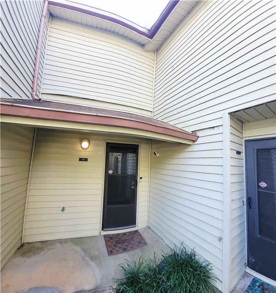 Beautiful 2 bedrooms, 2 and a half bath townhouse, plenty of natural light. !!! This is an end unit with tons of privacy and a short walk to the lake!!!.  Waterproof plank vinyl on the first floor. New roof. The double patio doors in the kitchen and in the living room offer a serene view.  The living room boasts a beautiful chimney and two barn doors, creating a stylish space. The kitchen has real wood cabinets and granite countertops.  *** Dimmable LED light fixtures in the entrance, living, and kitchen***. The patio features a lovely design for plant enthusiasts and is perfect for barbecues and gatherings. There is also a half bath on the first floor and a closet in the patio.  Wood flooring on the whole second floor. Two master bedrooms, each with its master bathroom located at opposite sides, offer total privacy. The laundry is located in the hall. Close to Stores, supermarkets, restaurants, banks, 2 Walmarts, Costco, 2 Home Depots, and highway 85.