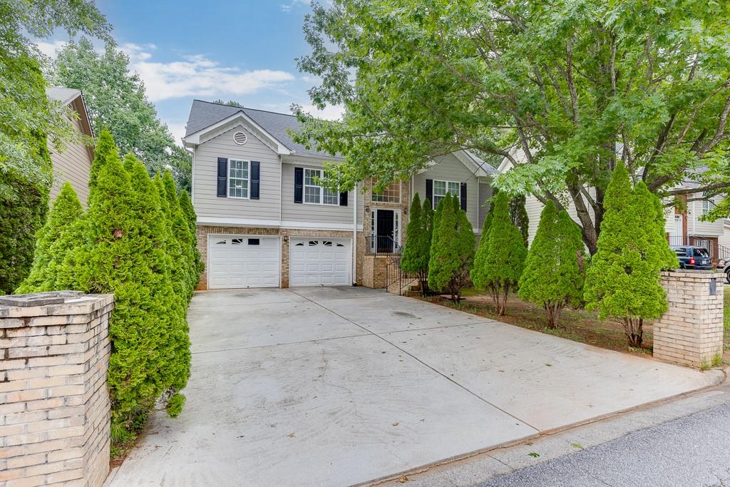 This home offers incredible space and flexibility to meet the needs of today’s lifestyle; it is ready for your personal touch and a quick closing! Located in a desirable non-HOA community, it features a bright family room with vaulted ceilings and a large formal dining room with an elegant tray ceiling. The kitchen comes fully equipped with plenty of cabinetry, a pantry, gas range, built-in microwave, dishwasher, refrigerator, and eating area —and even includes an additional stove in the garage for added convenience. The private owner’s suite, located on one side of the upper level, features a double vanity, garden tub, separate shower, and walk-in closet. On the opposite side, you'll find two spacious secondary bedrooms and a full hall bath. The lower level offers even more space with a laundry room, three additional bedrooms, and a full bathroom—perfect for a growing family, guest suite, home office, gym, or flex space. Step outside to a fenced backyard and open deck—ideal for entertaining or relaxing. Recent UPDATES include a newer roof, HVAC system, water heater, fresh paint in the main areas, and brand-new carpet throughout. Conveniently located just minutes from Ronald Reagan Parkway, Hwy 29, Scenic Hwy, Oak Rd, Bethesda Church Rd, parks, schools, restaurants, and more.