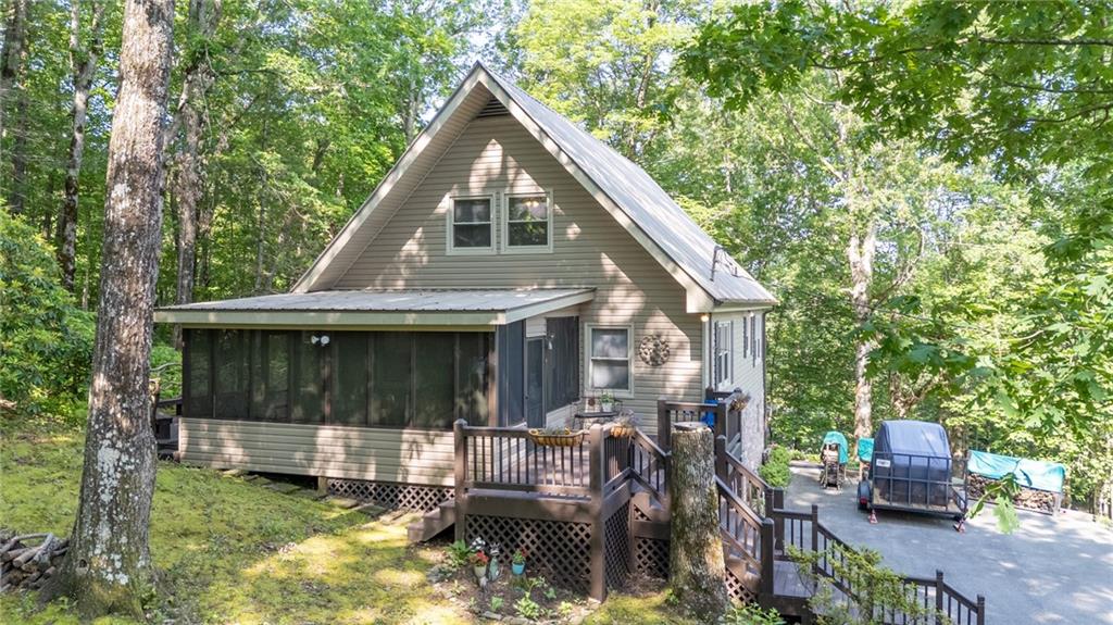 Charming Mountain Home Just One Mile from Fort Mountain State Park!
This beautifully maintained home blends comfort, efficiency, and thoughtful design—just one mile from the scenic trails of Fort Mountain State Park!
Enjoy reliable peace of mind with a whole-house Generac generator, and benefit from well-maintained community water for just $150 quarterly. Sensor lighting in stairwells and upstairs hallways adds smart convenience, while a wood-burning insert in the great room and whole-house attic fan help keep utility costs low.
The kitchen is a standout, featuring granite countertops, stainless steel appliances, and solid oak cabinets, all complemented by hardwood floors on the main level. A sunroom with floor-to-ceiling thermal-paned windows brings in beautiful natural light year-round. Solid wood interior doors on all bedrooms and bathrooms and a built-in bookcase in the family room add warmth and quality throughout.
You’ll love the variety of outdoor living spaces:
*A large screened-in front porch—perfect for entertaining while enjoying the fresh mountain air
*A spacious back deck ideal for grilling and gatherings
*A private side patio, offering yet another peaceful spot for relaxing or hosting
Other features include:
*Fresh paint throughout
*New carpet in the basement den
*Ample storage throughout the home
Whether you’re seeking a full-time residence or weekend retreat, this property offers functionality, comfort, and charm in an unbeatable location.