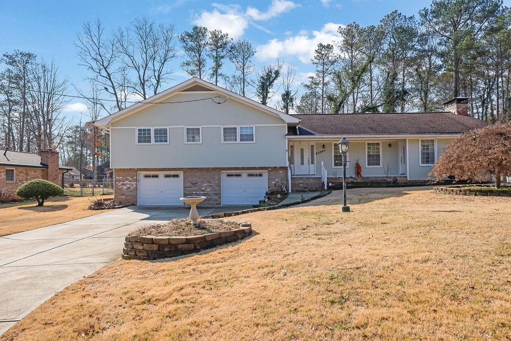 This updated mid-century home is located in the highly sought-after Pope High School district in the heart of East Cobb, offering the perfect blend of style, comfort, and convenience. As you enter, you're greeted by a spacious entryway that leads into a dining room large enough to comfortably seat 8+ guests. The kitchen boasts custom wood cabinetry and sleek stainless steel appliances, ideal for both everyday living and entertaining.
Step into the expansive living room, where there’s plenty of space for large furniture and a beautiful fireplace to enjoy on chilly evenings. The lower level offers a versatile flex room, perfect for a den or reading area, and features a finished space ideal for a media room or office. Additionally, a bright and inviting four-season room provides extra space for entertaining, a playroom, or simply relaxing.
Upstairs, the generous-sized bedrooms are complemented by fully updated bathrooms, ensuring comfort and style throughout. Outside, the backyard includes an outbuilding with a roll-up door, offering endless possibilities for a car enthusiast's dream garage, hobby shop, or she-shed.
With just 15 minutes to downtown Roswell, Town Center Mall for shopping, and a variety of dining options, this home offers both a peaceful retreat and proximity to everything you need.