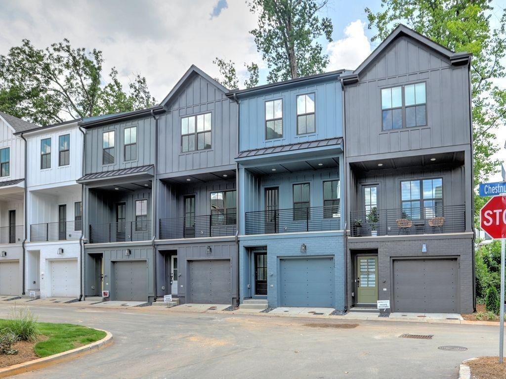 Experience Elevated Living with Unmatched Privacy and Style! Move-in ready and freshly painted, this rare Buckley townhome offers a private, unobstructed view of the quiet mews — not directly into another balcony like most units. Enjoy a sense of openness and privacy from your covered balcony with metal roof, perfect for year-round relaxation. Inside, the home features soaring ceilings, expansive windows, and premium LVP flooring throughout. The chef’s kitchen impresses with an oversized island, sleek quartz countertops, stainless steel appliances including the fridge, soft-close cabinetry, and designer hardware. The spacious primary suite boasts a walk-in closet and a spa-inspired bath with double quartz vanity, designer fixtures, a fully tiled shower, and a seamless glass door. The secondary bathroom features a tiled tub surround, quartz countertop, and upscale finishes. Laundry room upstairs features top-of-the-line washer and dryer. A two-car tandem garage includes oversized storage bays — perfect for gear, tools, or seasonal items. Enjoy access to Buckley’s open-air clubhouse with wet kitchen and outdoor fireplace, perfect for hosting guests. Just one block from Chastain Park, prime location offers walkability to tennis, golf, trails, and the amphitheater, plus close to top schools, boutiques, and dining. Easy access to I-285. This home is also for lease see FMLS # 7617793.