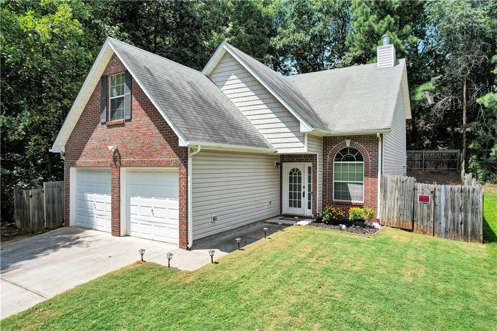 Welcome Home to this beautifully maintained 4-bedroom, 2.5-bath home nestled in the heart of Austell! Offering the perfect blend of space, functionality, and flexibility, this home is ideal for the first time homebuyer or investor. Step inside to find a spacious master suite on the main level complete with a generous walk-in closet and a serene master bathroom featuring a separate shower and a garden soaking tub—your personal retreat after a long day. Upstairs, you’ll find three additional bedrooms plus an oversized bonus room with a closet and window, perfect for a fifth bedroom, home office, or media room —the choice is yours! Enjoy the elegance of a two-story living room with open views into the dining area and kitchen, perfect for entertaining or keeping everyone connected. The kitchen offers ample cabinet space, a tile backsplash, a pantry and appliances; including the refrigerator. Outside, a fenced backyard provides privacy and space for pets, play, or gardening. The two-car garage adds storage and convenience. No HOA and No Rental Restrictions! Don’t miss your chance to make this versatile and inviting property your new home. Schedule your private tour today before it’s gone!