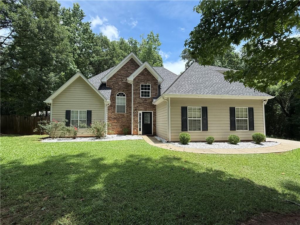 Tucked away on a beautifully landscaped 1.27-acre lot in desirable Henry County, this 3-bedroom, 2.5-bath gem offers the perfect blend of modern comfort and Southern charm. Step inside to find a freshly updated interior featuring stylish new flooring and paint throughout, creating a bright and inviting ambiance. This home comes furnished but the owner will remove furniture upon move-in. The heart of the home is the modern kitchen, equipped with sleek countertops, ample cabinetry, and all appliances—ideal for both everyday living and entertaining. Unwind in the cozy living space, or take the fun outdoors to your private fenced-in backyard, complete with screened and open patio areas—perfect for sipping morning coffee, hosting gatherings, or soaking in the peaceful surroundings. Enjoy the best of both worlds with easy access to McDonough Square, offering boutique shopping, delicious dining, and community events—all while retreating to the serenity of your own private haven. Located in the top-rated Ola school district, this move-in-ready home checks all the boxes for families and those seeking space, style, and convenience. Don’t miss this rare opportunity, schedule your tour today and fall in love with your next home!
