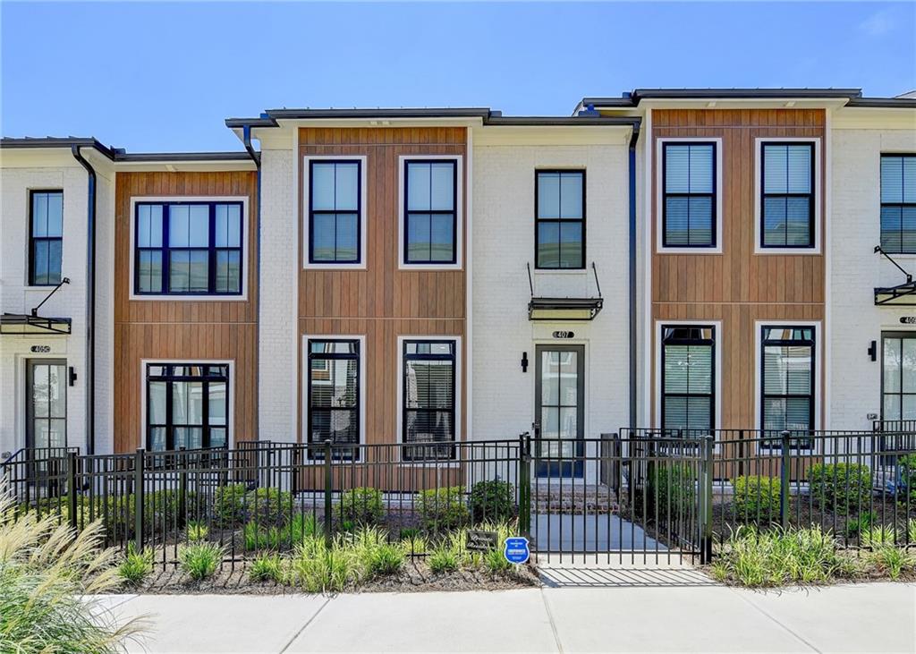 OWNER RELOCATING—DON’T MISS THIS RARE OPPORTUNITY!
EAST-FACING & MOVE-IN READY! Immaculate, sunlit townhome in prime Alpharetta location! Popular sold-out floor plan features 3 spacious bedrooms, 3.5 baths, and a versatile layout across 3 levels. Gourmet kitchen boasts quartz countertops, GE SS appliances, soft-close cabinets, under-cabinet lighting & walk-in pantry. Sunroom off kitchen makes a perfect office or dining space w/access to deck. Spacious family room and open dining area ideal for entertaining. Upstairs features oversized owner’s suite w/tray ceilings, walk-in closet & spa-like bath. Terrace-level guest suite w/full bath & walk-in closet. 2-car garage + 2-car driveway. Ample guest parking. Incredible location—moments to Avalon, Downtown Alpharetta, Alpha Loop, Big Creek Greenway & future North Point redevelopment.