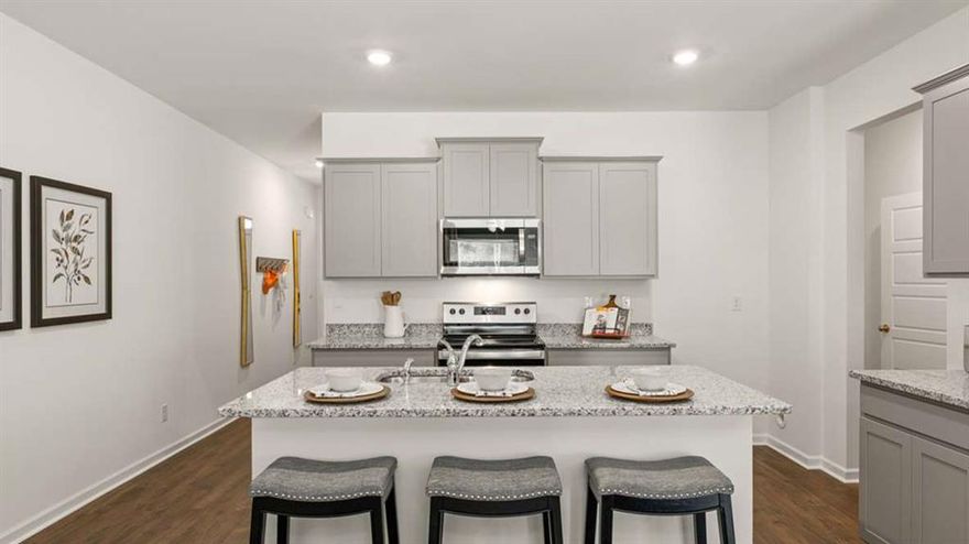 The Stratford Floor Plan End Unit is a newly constructed, two-story townhome designed for modern living. This spacious home features a loft, three bedrooms, 2.5 bathrooms, and a two-car garage.  The open-concept main floor boasts a stylish kitchen with 42C cabinets, an island comfortably accommodating family, crown molding, a chic tile backsplash, and elegant quartz countertops. The space flows seamlessly into a cozy living area and a dining spaceCoperfect for entertaining.  Upstairs, two secondary bedrooms share a convenient Jack-and-Jill bathroom and offer generous walk-in closet.  The primary suite serves as a private retreat, complete with an en-suite bath and a spacious walk-in closet.  With contemporary finishes, ample storage, and a low-maintenance exterior, this townhome blends comfort and functionality in a prime Barrett Parkway locationCojust minutes from parks, dining, and shopping.   May estimated delivery time.