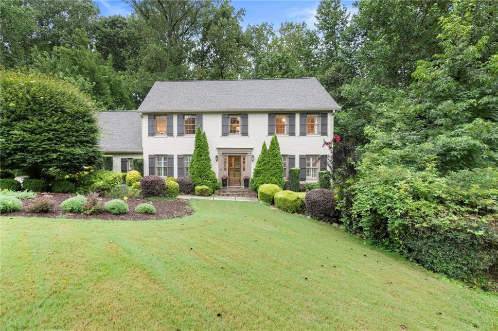 Your wait is OVER! Hurry in to this DREAM HOME in one of East Cobb’s most desirable Swim/Tennis communities, served by TOP SCHOOLS! From the charming Cul-de-Sac to the Gorgeous, Brick Traditional Curb Appeal, fantastic Open Flow, Designer Touches and Beautiful Backyard, you will LOVE this home! Enter the welcoming foyer and you are immediately taken by the Elegant, Open Great Room with a sophisticated Wall of Built-in Bookshelves and ENORMOUS space to relax and entertain. Refined finishes greet you at every turn, including custom trim and wainscoting, dental molding, designer wallpaper, built-in cabinetry and more. Love to entertain? Plenty of room for Dinner Parties in the elegant Formal Dining Room with an easy flow to the Updated Kitchen featuring Shaker Cabinets, Granite and Carrerra Marble Tile Backsplash. The Kitchen AND the Great Room open onto the spacious Deck, perfect for Cookouts and Outdoor entertaining. Enjoy your favorite beverage on deck as you watch the games underway in the lush, level, private backyard. So many spaces to relax and unwind! Six Bedrooms include a spacious Primary Suite and an Over-sized Bonus Room/Flex Room, ideal as an upstairs Rec Room, Office or more.
The Full Finished Basement offers a large, open Rec Area with room to binge watch TV, Work Out or just hangout.  And the private bedroom makes an ideal Teen or Guest Suite. This dream home is located in the heart of East Cobb, near top destination spots; Shopping, Restaurants, The Avenue, Historic Roswell, Sandy Springs and miles of glorious Nature Trails in the Chattahoochee Preserve.  Nestled beside Mount Bethel Elementary School, Princeton Lakes is known for friendly neighbors and fantastic amenities, including a clubhouse, playground, pool, tennis courts, beautiful Lake and fishing spots! Served by Mount Bethel ES, Dickerson MS, and Walton HS – Top Ranked Schools recognized for excellence. A RARE opportunity to have the BEST that East Cobb has
to offer! Don’t miss it!