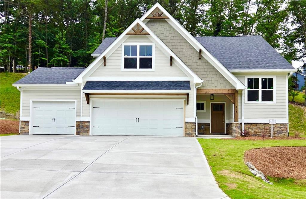 Ready July 2025!!Great Master on Main Plan with 3 Car Garage! Charming Covered Front Porch on Full Unfinished Basement! 3 Bedrooms 2 Bath Open Floor Plan, Rear Covered Deck with Beautiful Wooded Mountain Views, Gourmet Kitchen with Granite Counters and Loads of Cabinet Space. Private Master Suite with Double Vanity, Walk In Closet and Spacious Shower.