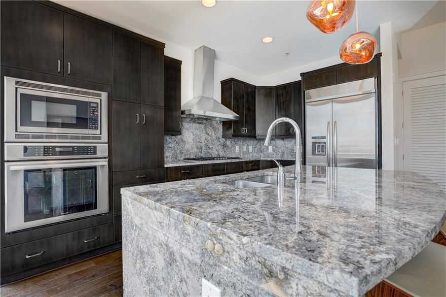 Live high above the prized Loews Midtown! 12' ceilings f/ great N/E views. Ready to accommodate guests with custom built-in wall-bed. Home offered with remaining furnishings! Thermador appliances incl nat gas cooktop ready for you or your exec chef. Bedroom is cal-king ready. W/D and custom built-in closets all included. Oversized master bath suite incl Victoria/Albert bath fixtures, frameless shower, separate water closet + marble floors. Laundry room includes sink. Owner's amenity suite on 28th floor features heated pool, entertainment/event room, grilling all separated from Loews Hotel. Private owner's access to gym at Exhale spa. Only 52 residences, 5/floor offers private luxury. Own below cost of today's new const!! Prime luxurious living directly above the plethora of shops/restaurants at 11th Peachtree sts. Steps away from Piedmont Park!