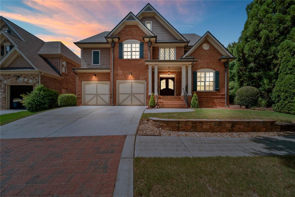 Beautiful and spacious 4-side brick home located in a gated community in the sought-after Brookwood area of Snellville. Enjoy peace of mind with guarded entry and access to top-notch amenities. Step into a grand two-story foyer and hardwood floors that flow throughout the main level, excluding the living room. The open-concept kitchen features an integrated refrigerator and overlooks the living area, perfect for entertaining. A large flex room offers endless possibilities—office, gym, playroom, or guest space.
Upstairs, you'll find more hardwood flooring throughout the halls, with carpeted bedrooms for comfort. The oversized master suite includes a walk-through closet, dual vanities, a stunning standing shower, and a relaxing jetted tub. Each secondary bedroom has its own full bath and walk-in closet. The spacious laundry room adds even more convenience.
Downstairs, the full unfinished basement is ready for your personal touch—create a home theater, in-law suite, or game room. Outside, enjoy a beautifully painted and oversized deck. All of this in a durable, elegant 4-side brick construction offering timeless curb appeal and low maintenance.