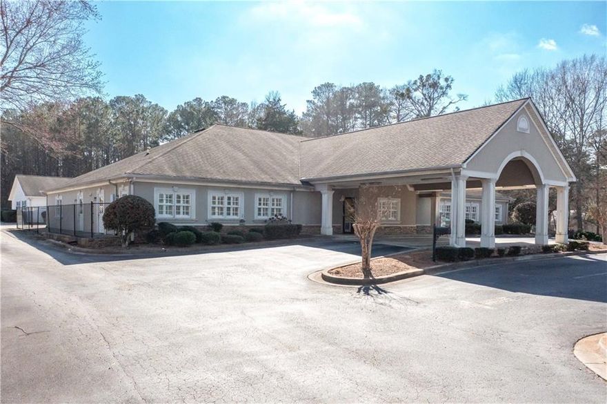 Unlimited possibilities in a great location is available for a new owner. This commercial building has no interior load bearing walls and can be customized to suit your business needs. Business is not included in list price. Currently operating as a daycare licensed for 146 children. Current layout includes a lobby, reception area, private office with bathroom, classrooms with bathrooms and access to playground areas and full kitchen are in the main building. Second detached building has lobby area, classrooms with bathroom, storage closet and access to playground. Two fenced playroom areas. Private paved parking with 12 parking spots, covered drop out/pickup for customers and clients, additional gravel parking located in rear of main building. Easy access to I-20, Highway 61 and Highway 101. Directly across from Villa Rica City Hall, Post Office, banking and more.