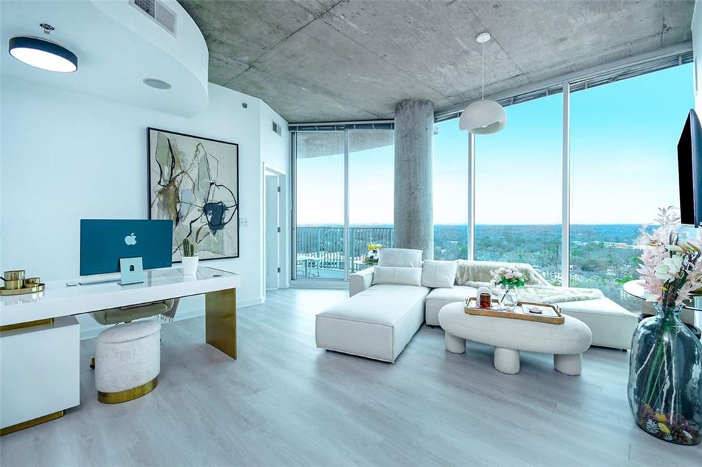 Priced to sell - Welcome to The Twelve Atlantic Station No. 2122! Luxury corner unit condo boasting breathtaking and unobstructed city views, this residence offers the finest in high-rise living with state-of-the-art amenities and exquisite upgrades throughout. Step inside to find brand-new luxury plank flooring and fresh paint throughout, creating a sleek and contemporary ambiance. Floor-to-ceiling windows flood the space with natural light, while the open-concept layout enhances the sense of space and grandeur. The gourmet kitchen features high-end stainless steel appliances, granite countertops, and custom cabinetry, seamlessly flowing into the spacious living and dining areas—perfect for entertaining. The primary suite boasts a custom walk-in closet and spa-inspired en-suite bathroom, complete with a soaking tub, rainfall shower, and designer finishes. Residents enjoy world-class amenities, including a 24-hour concierge, resort-style pool, fitness center, club lounge, and private parking. Located in vibrant Atlantic Station, you’re steps from Atlanta’s best shopping, dining, and entertainment. This move-in-ready condo is available with negotiable designer furniture, making it the ultimate turnkey luxury home. Schedule your private showing today!