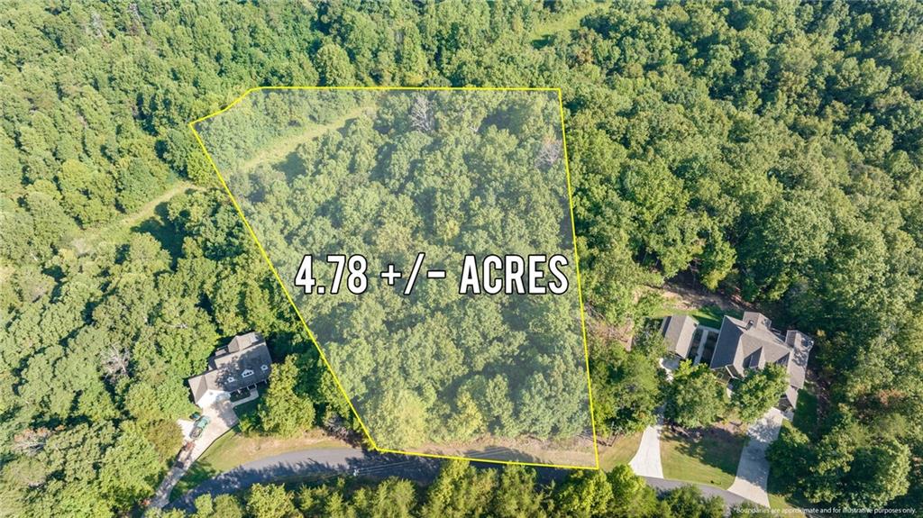 Gorgeous 4.7 acre lot in Dahlonega which includes 80+ feet of frontage on Long Branch Creek. Bring your builder and plans and create your castle at the top of the hill. Views for miles in this subdivision. Single entry and exit, so no pass through traffic! Just a short drive to historic Dahlonega and North Georgia College. In Gold Cove.