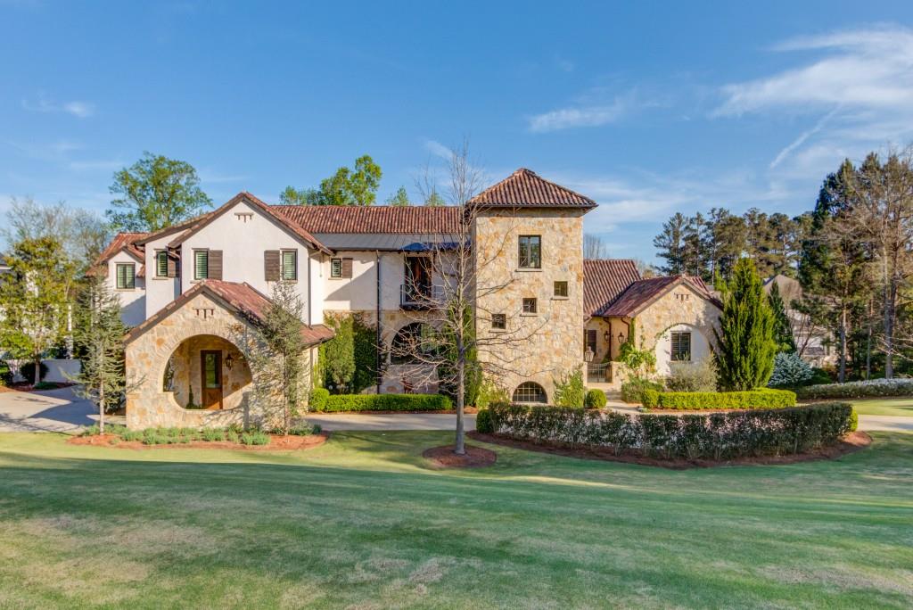 Mediterranean masterpiece in The River Club is a true labor of love with no detail overlooked.  With Italian, French and Napa influences, this home has been featured in magazines  Construction by Capitella Homes and designed by TS Adams to make sure every detail was true to study.  Highlight of some of these details include the Tower, the placement size and style of windows, the extra depth of the walls and window wells, the aggregate driveway and the custom chimney caps.  In addition to amazing details, the home boasts 6 bedrooms with the Primary Suite on  Main. Main Kitchen with brick barrel vault ceiling with exposed beams, custom vent hood and cabinetry with 12' island.  Prep kitchen tucked away with Subzero refrigerator and freezer, Wolf microwave and oven,Bosch dishwasher, open shelving and a pass through window to the grilling deck.  The Formal Dining Room is highlighted by 1000 bottle temperature controlled wine cellar.  Herring bone pattern in fumed oiled finished hardwood flooring mix with Greek limestone beautifully to allow the use of Nano doors to bring the outside in for maximum enjoyment.  Upstairs boasts 4 ensuite bedrooms and Family Retreat/Club Room.  Elevator service to all three floors.  The terrace is level is full of light and all the same details you would hope for!  Concrete bar with full appliances, a conversation area, a large media room for gathering, a home gym with rubber flooring, pool/spa bath with sauna, and luxurious guest suite.  Gracious entertaining is made easy with additional panoramic doors opening to poolside.  All landscaping selections were studied to be in keeping with the architecture with an Olive Tree right outside the front courtyard entrance. Did I mention the "Secret Garden"?