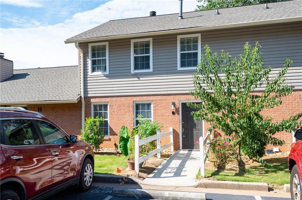 Welcome home to your beautifully maintained, multi-level townhouse. Pulling up to your assigned parking spot, conveniently located by your front door, and stepping into your lovely open living space provides the tranquility you are looking for. Entertaining guests or enjoying your quiet time is made possible by a cozy fireplace anchoring the living and dining rooms. The kitchen, featuring a new stove/oven, overlooks the private patio space. The spacious 3 bedrooms and 2.5 baths provide everyone a space to unwind. The community offers swim/tennis. Location to Ga 400, Morgan Falls Park, and a vibrant array of shops and restaurants has this home offering both comfort and convenience!