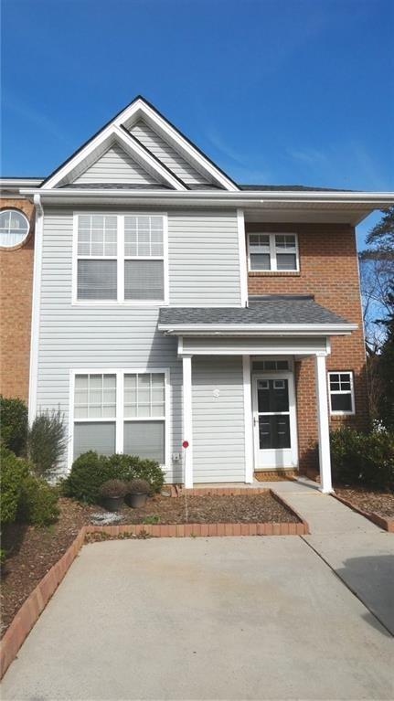 Beautiful end unit townhome in the heart of Dawsonville. 3 bedroom/2.5 bathroom home features LVT flooring throughout, a cozy fireplace, and enclosed sunroom, fenced backyard, and a one of a kind flagstone patio. Oversized master suite with large closet and whirlpool tub. 2 large guest rooms and tons of storage. Freshly painted, cleaned and move in ready! Professionally managed, must see!