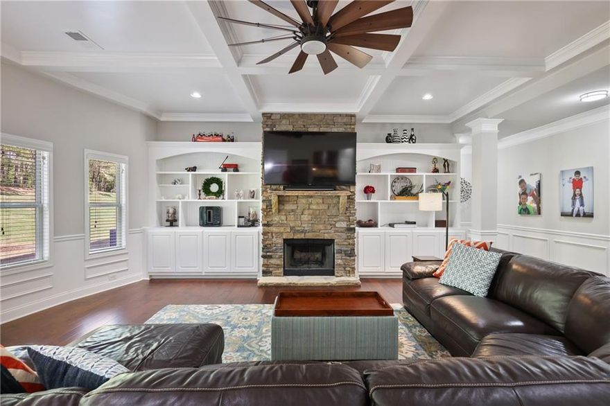 Located at 1622 Bunting Forest Court in Marietta, GA, this stunning 6-bedroom, 5-bathroom home with inverted basement offers nearly 6,140 square feet of thoughtfully designed living space on a beautifully landscaped 0.49-acre lot. The beautifully landscaped front yard welcomes you in through the two story foyer to the formal front room and dining room. The open floor plan on main features a large eat in kitchen, breakfast room, and great room with built-in bookcases and cozy stone fireplace. A full bathroom and guest room finish out the first floor. The second floor is home to a great media/play room, built-in work stations, two bedrooms, a full bath, laundry room, and the primary suite. The primary suite is home to an oversized bedroom, sitting room, spa like bathroom, and oversized dual sided closet. What makes this home special is the inverted finished basement space on the third floor. Complete with two bedrooms, two full bathrooms, and a bonus room with built in bookcase and bar, this space gives its residents room to expand! Outdoors, enjoy your own private bocce ball court, a spacious covered patio, and a tree-lined yard that offers both privacy and tranquility. Just minutes from Kennesaw Mountain National Battlefield Park, top-rated schools, shopping, dining, and a swim community across the street to join, this energy efficient home offers a rare combination of luxury, location, and lifestyle.