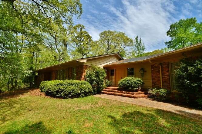 Remarkable Lake Lanier property! Over 30 acres, with over 2700 feet of shoreline. This property has Corps of Engineers approval for a 10 slip dock. Completely private oasis! Rambling brick ranch featuring 5 bedrooms, 4 baths. Vaulted ceilings, formal dining room that seats 12 or more, brick floor breakfast room and den. Foyer with newly refinished parquet flooring and floor-to-ceiling window to soak in the backyard and courtyard. The "bedroom wing" offers 3 oversized bedrooms, all complete with large closets and bathrooms. The other 2 bedrooms are the opposite side of the home with the kitchen, large laundry/mud room and 4th full bath. Screened porch, road to the dock, ample parking. Brand new roof! The potential for this home is endless. Close to everything Gainesville has to offer and in the heart of one of the most coveted neighborhoods in the city. Adjoins the 168 acre Atlanta Botanical Gardens Gainesville.