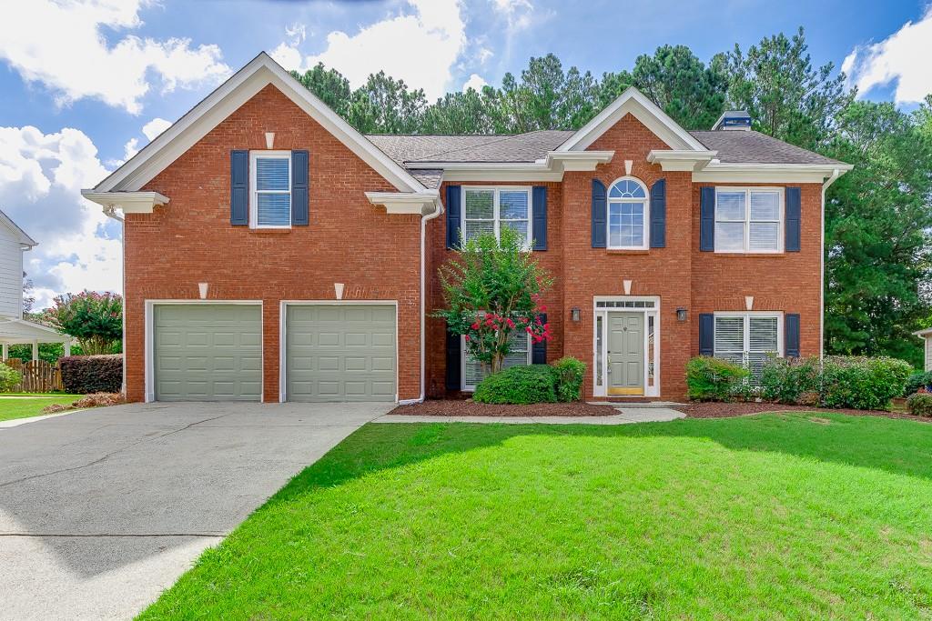 This move-in ready 2-story brick-front home is located in the highly sought-after Hamilton Mill community with resort-style amenities and the Mill Creek school cluster. The main level welcomes you with fresh updates including NEW interior and exterior paint, REFINISHED hardwood floors. You’ll find a separate formal dining and family room, along with a cozy living room featuring a fireplace, wood-paneled accent wall, and ceiling fan. The kitchen has been beautifully updated with stainless steel appliances, including a NEW gas stove, NEW microwave, dishwasher, and refrigerator. An oversized pantry, breakfast area, and built-in mail center make the space as functional as it is inviting. A laundry room and guest bath complete the first floor. Upstairs, the main suite features a relaxing retreat with a double tray ceiling, wood-paneled accent wall, upgraded lighting, a spacious walk-in closet, and a spa-like bathroom with double vanity, separate tub and shower, and linen closet. You’ll also love the 3 additional spacious bedrooms and 2 FULL baths that provide plenty of room for family or guests. The backyard is fully fenced, freshly landscaped with new sod, and features a deck—perfect for relaxing evenings or weekend gatherings. LAWN CARE IS INLCUDED for added convenience. You’ll enjoy Hamilton Mill’s incredible amenities, including eight tennis courts, a basketball court, beach volleyball, playground, resort-style pool, and kids’ pool. Conveniently located off I-85 (Exit 120) and Braselton Hwy, the home is just minutes from schools, Publix, Walmart, Chick-fil-A, Home Depot, Kohl’s, movie theaters, churches, parks, and so much more. ***We DO NOT list rentals on Craigslist nor Market place. Only communicate with The Gwin Team, beware of rental scams - this house is professionally listed by The Gwin Team, ONLY speak with a member of The Gwin Team***