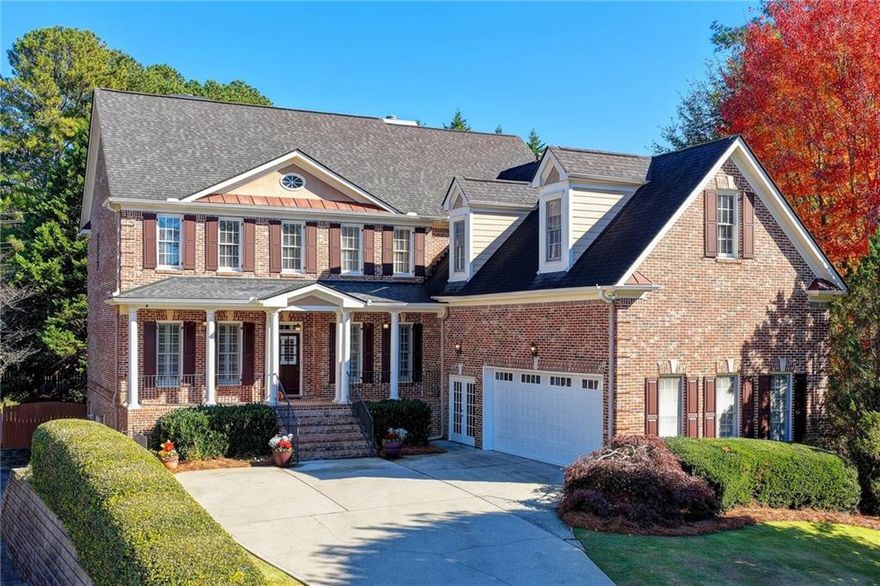 This luxurious home is now available in the coveted gated community of Barrington in Suwanee! This gorgeous brick beauty boasts timeless curb appeal with lush landscaping and a welcoming front entry on a cul de sac lot. Step inside to find 10-foot ceilings and plantation shutters throughout the main level, filling every room with light and elegance. The spacious Family Room features custom built-ins and detailed crown molding, while the chef’s Kitchen impresses with granite countertops, wood-grain cabinetry, stainless steel appliances, a gas range, and a large island with seating in addition to a breakfast nook. Just off the Kitchen, an open-concept Hearth Room invites cozy gatherings around the fireplace. A main-level Bedroom with a walk-in closet and a newly remodeled full bath makes for a perfect guest suite. The formal Dining Room easily seats 12+, ideal for holiday dinners and entertaining. Upstairs, the spacious Primary Suite offers a private sitting area, trey ceiling, and a cozy fireplace. The lavish Primary Bath showcases a large glass shower, soaking tub, and beautifully updated dual vanities. Secondary bedrooms are spacious with private bath access, and the laundry room is conveniently located upstairs. The finished basement is its own retreat — complete with a full kitchenette (including a full-sized fridge, dishwasher, and quartz counters), Rec Room, Media Room, true 6th Bedroom, full bath, and a spa-worthy dry sauna that seats up to 7 people! Smart switches throughout the basement and exterior offer modern convenience and energy savings. Step outside to your private oasis featuring an oversized cedar, vaulted-ceiling screened porch.  Imagine enjoying your morning coffee or your evening glass of wine anytime of the year.  The fenced backyard also includes a relaxing hot tub and a fire pit--perfect for enjoying special moments with family and friends. Additional perks include a second side driveway with extra parking and basement access, plus a pristine garage with high lift doors and an epoxy floor. Located in the award-winning North Gwinnett School Cluster, Barrington residents enjoy close proximity to Suwanee’s best shopping, dining, and parks — including a private neighborhood entrance to Sims Lake Park. Don’t miss your chance to own this exceptional home in one of Suwanee’s most sought-after communities!