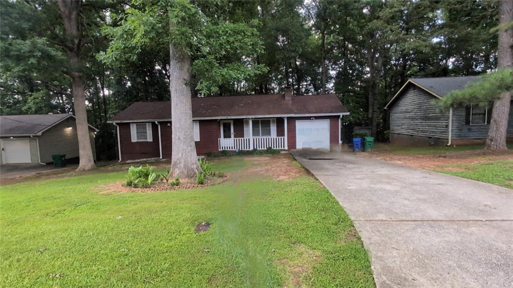Charming 3-bedroom, 2-bathroom, ranch-style home on a large private lot in a desirable neighborhood. The home is very well maintained and boasts new LVP floors throughout. Enjoy the convenience of an attached garage, a driveway for additional parking, and a backyard perfect for relaxation or entertaining on the huge multi-level deck. Easy access to Arabia Mountain, walking trails, Panola State Park, shopping, and major highways, this home is move-in ready and full of potential. Don't miss the opportunity to make this exceptional home your own. Schedule a showing today and experience the perfect blend of city living and natural beauty!
