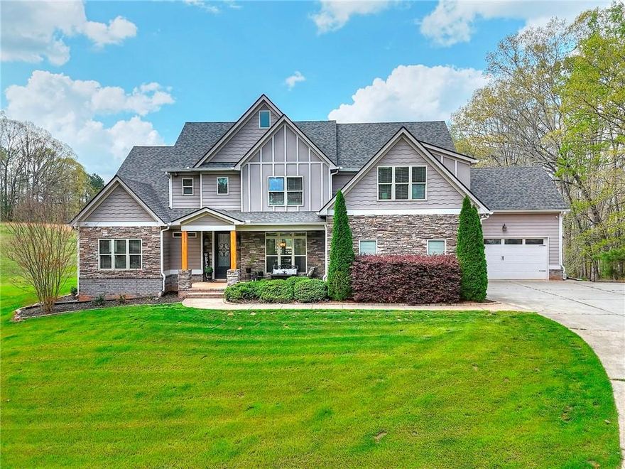 Looking for your perfect hideaway that is located just minutes from town? This custom built home is a STUNNER! Situated on just over 12 acres, this home offers the utmost in comfort, luxury and privacy. Outside you will enjoy the long, private driveway, ample parking space with two 2 car garages on main level.  This setting is truly serene! Inside the sellers took no shortcuts in their design decisions from the Oak Hardwood Flooring throughout to the two story family room with stacked stone fireplace, you will be blown away! Beautiful gourmet kitchen with an 8ft Island!  Large Primary bedroom and a guest room on main level with an additional three bedrooms upstairs each with their own private bathroom.  Need more space? The basement is a blank slate that is plumbed for a kitchen and bathroom ready for your finishing touches! One of the best spaces is definitely the covered back patio with long porch overlooking the beautiful backyard with room for a pool and more!  This one is a MUST see!  No HOA! EV Charger in garage.