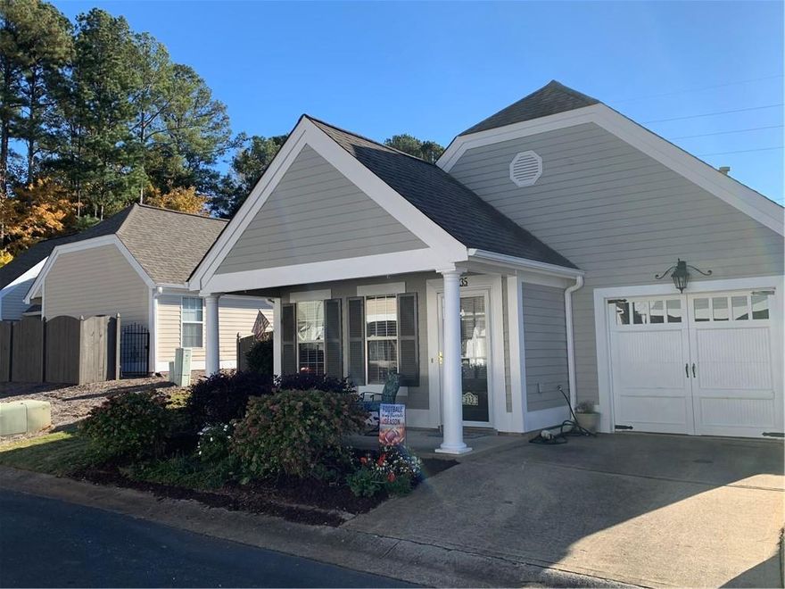 Welcome to the desirable Cottages at Towne Lake, a private end-unit in Woodstock’s favorite community offering serenity and a spacious atmosphere. This active adult community welcomes all ages — there are no age restrictions. Enjoy wonderful amenities including a community pool for relaxing swims and social gatherings. Step inside to an inviting entry leading to the bright family room with a cozy fireplace, perfect for warm evenings. The open kitchen features ample cabinet and counter space, making meal prep a pleasure. The generous master suite includes space for a home office or quiet reading nook. A second bedroom offers convenience with direct bathroom access. Step outside to a large garden patio bursting with established plants and vibrant flowers for year-round color — your own outdoor oasis. Enjoy quiet living, privacy, and all the comforts of a well-designed home in a community close to shopping, parks, and top-rated schools.