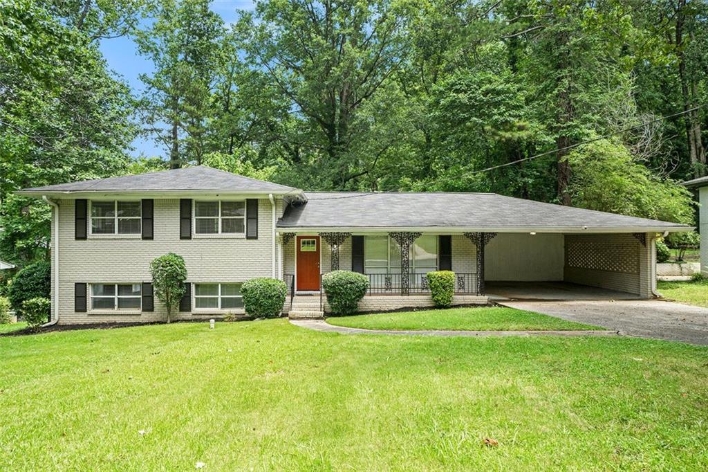 Move-in ready split-level home featuring a spacious 4/2 layout, a bonus family room, a covered carport, and a well-kept backyard ideal for outdoor enjoyment. This well-maintained property offers ample living space and comfort, perfect for a variety of household needs.