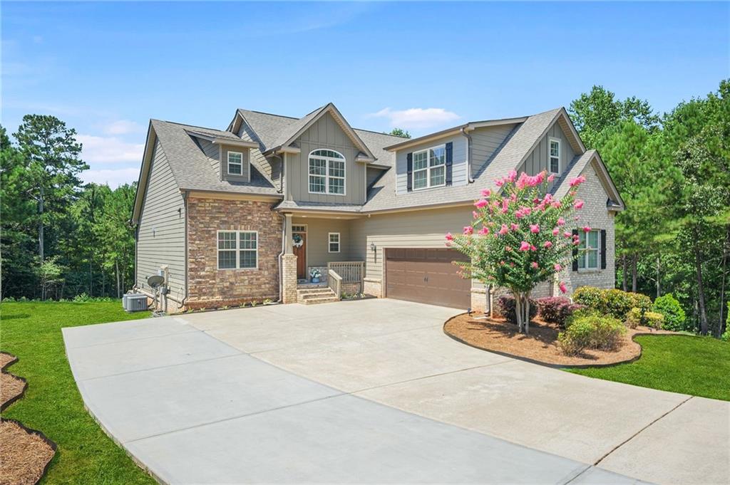 Welcome to 205 Calvery Way, located in the highly sought-after Aspen Brook non-HOA community of McDonough!
This car-stopping 5-bedroom, 4.5-bathroom estate home delivers exceptional elegance, unmatched features, and a generous $10,000 bonus incentive that puts more buying power directly into your hands.
Built in 2018 and offering 4,659 square feet of refined living space, this custom-built home sits on a massive 1.38-acre private lot with irrigation, basketball court, and hot tub; providing a peaceful setting without sacrificing convenience.
Premium features include stunning brick & stone curb appeal with lush landscaping as the backdrop to extended driveway parking. Cook for your guests in the Gourmet chef’s kitchen with quartz countertops, oversized island, custom cabinetry, gold designer lighting, and open view into the living room. Enjoy family movie nights in the theatre located in the fully finished basement.
If you've been searching for a home that checks every box; space, style, privacy, and perks; you've just found it. Schedule your private tour today and experience the elevated lifestyle that awaits