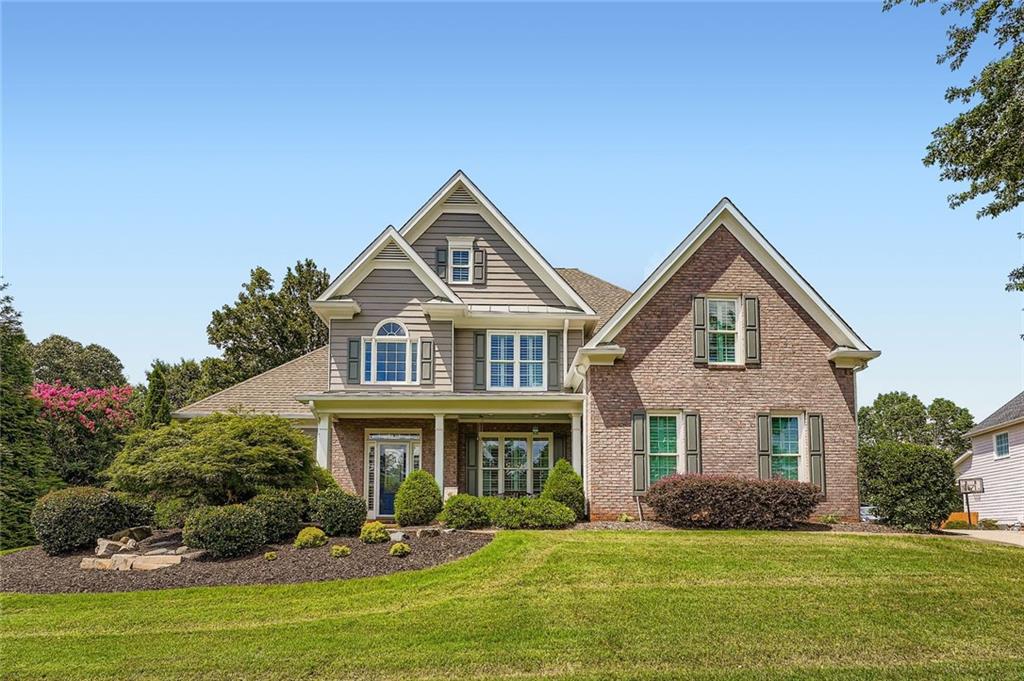 Welcome to 405 Dogwood Way, located in the highly sought-after BridgeMill neighborhood. This meticulously maintained and extensively upgraded home offers the perfect blend of upscale design, spacious living, and outdoor amenities ideal for entertaining. Inside, you'll find a completely renovated designer kitchen featuring custom cabinetry, high-end appliances, and modern finishes. The owner's suite is conveniently located on the main level, and all bedrooms throughout the home are exceptionally spacious. Additional interior upgrades include new windows across the front of the home, fresh interior and exterior paint, and a 3-car garage. The backyard is a true highlight of the property, designed for both relaxation and recreation. It features a zero-entry heated gunite pool and spa with smart controls, a full sand volleyball court with sand imported from 30A, and an expansive patio space perfect for hosting guests and parties. This home is located in BridgeMill, one of Cherokee County’s premier communities, offering access to a full suite of amenities including a championship golf course, swimming pools, tennis and pickleball courts, a fitness center, on-site restaurant, parks, walking trails, and year-round social activities. Conveniently situated just minutes from Lake Allatoona, residents can enjoy access to multiple marinas including Little River Marina, and the nearby restaurant famously featured in the television show "Ozark", J.D.'s on the Lake This property combines refined interiors, resort-style outdoor living, and a vibrant community lifestyle in one exceptional offering. Don't miss out! Schedule your showing today. A discounted rate (0.5% rate buy down) and no lender fee future refinancing may be available for qualified buyers purchasing this home and using an affiliate of Orchard Brokerage, LLC.