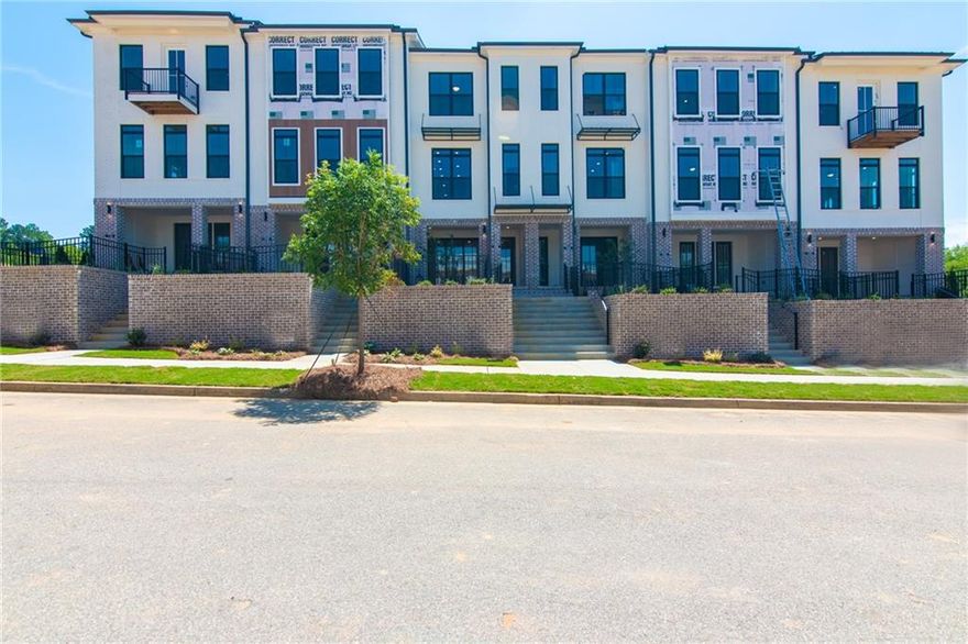 Spring into a New Home with The Providence Group! Timeless style and modern comfort in this beautifully designed 2-bedroom, 2.5-bath townhome. Perfectly blending high-end finishes with practical functionality, this residence offers everything you need for refined, everyday living. From the moment you arrive, you'll be greeted by a private front entry, a fenced-in yard, and a covered terrace—a perfect outdoor retreat for morning coffee or evening entertaining. On the entry level, a flexible bonus room provides the ideal setup for a home office, gym, or media room, with natural light pouring in through large windows and dual access points. Upstairs, the main level is a true showstopper. The open-concept family room features an electric linear fireplace and dining area flowing effortlessly into a designer kitchen featuring Quartz countertops, 42” Cabinetry with elegant crown molding, and soft-close doors. GE stainless steel appliances, make cooking and entertaining a delight. Step out onto your private wooden deck for seamless indoor-outdoor living year-round. The top floor features a serene owner's suite complete with a spa-like bath, plus a spacious secondary bedroom with its own full bath. A convenient laundry closet is thoughtfully placed for easy access. For a limited time, you'll be able to personalize your dream home with one of our design packages created by our award-winning design team. Ideally located in the IveyBrooke community, you're just minutes from Avalon, Downtown Alpharetta, Top Golf, The Cooler, and a wide variety of shopping, dining, and recreation. Additional features include a one-car garage with EV charging station, driveway parking, and ample guest parking throughout the neighborhood. Photos and Virtual Tour are of previously built Barnsley Plan.
Home is under construction – Estimated Completion: December 2025 [The Barnsley I]