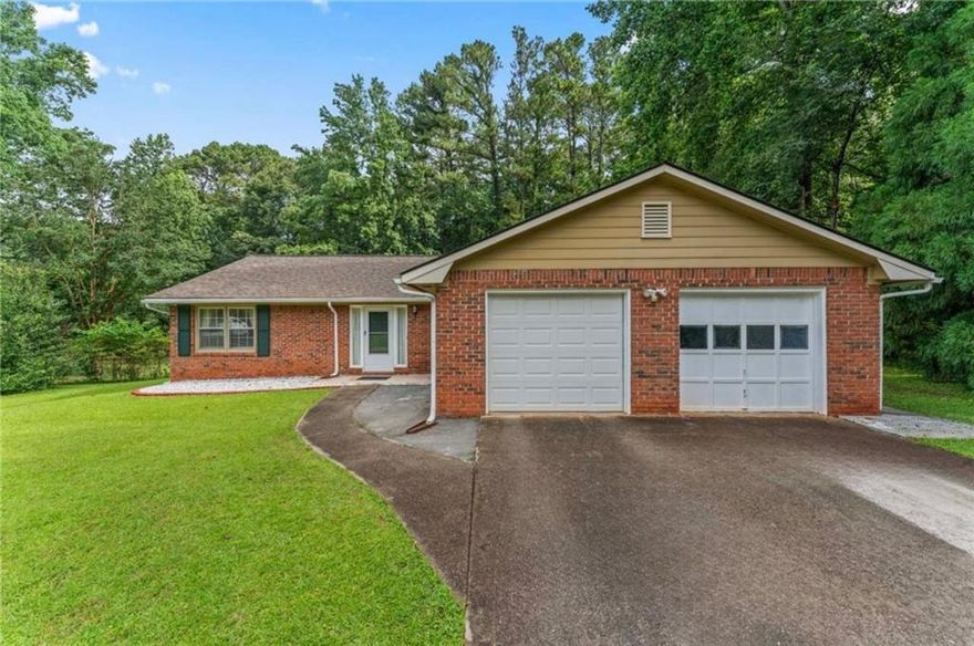 Welcome to 1738 Sherry Lane! This pristine all-brick ranch home boasts a brand new roof, new vinyl flooring, fresh kitchen cabinets, and a newly refinished garage floor! Nestled on over half an acre, this charming 4-sided brick ranch-style residence features a secluded, tree-lined, fenced backyard. This immaculate home includes 3 bedrooms and 2 bathrooms, showcasing an open floor plan. The inviting family room, complete with a cozy fireplace, seamlessly connects to a separate dining area, making it ideal for entertaining. The kitchen is a chef's dream, featuring newly-stained cabinets and solid surface countertops. The spacious primary suite includes two walk-in closets and a bathroom that offers updated countertops and a shower tub combo, creating a tranquil retreat. Two additional guest bedrooms share an updated and remodeled full bath. Step outside to the covered deck, where you can enjoy the privacy of the fenced backyard, perfect for outdoor gatherings, complete with a fire pit for those cozy fall evenings. This home is conveniently located near Lake Spivey, providing easy access to the interstate, shopping, and dining options. With no HOA fees or restrictions, this home won't last long. Don't miss this fantastic opportunity to make it your own!