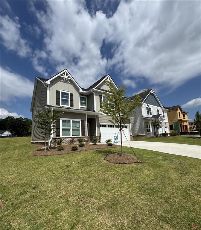 Step into this beautiful brand new construction, featuring 5 bedrooms and 3.5 bathrooms. The perfect blend of space and style with unlimited decor opportunities. Energy efficient LED lighting throughout! The foyer entrance leads to a spacious family room setting with an electric fireplace that gives great aesthetic, along with coziness and comfort. A modern galley style kitchen offers inviting light, a breakfast eating area, an extended island bar with under-mount stainless steel sink, granite countertops, stainless steel appliances, pantry and plenty of cabinet space. An adjacent formal dining room is great for hosting special occasions, and creating lasting memories. The upper level has over-sized secondary bedrooms with walk in closets and are located near a full bathroom with dual vanity. The Owner's suite offers a perfect blend of space that's complete with a luxurious bath with separate shower, glass shower door and separate tub with tile surround for the ultimate relaxation experience. Laundry room is conveniently located on the upper level. Minutes from downtown Covington Square.