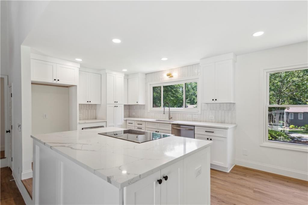 This beautifully updated home features an open-concept layout with a brand-new kitchen, modern flooring, stylish bathrooms, and fresh interior paint throughout. Enjoy the spacious backyard and large deck—perfect for entertaining. Exterior upgrades include newer roof, updated paint, and professional landscaping. Located in a quiet neighborhood with top-rated schools, this home offers both comfort and convenience. Move-in ready and sure to impress!