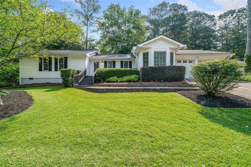 Step into comfort and style with this beautifully expanded 3 bedroom, 2 bath ranch style home nestled in the highly coveted Lassiter School District. Boasting 1,800 square feet of thoughtfully designed living space, this house features gleaming hardwood floors, elegant stone countertops, and a cozy gas log fireplace. Thoughtful additions have expanded the living and dining areas, creating a spacious and inviting atmosphere perfect for entertaining or relaxing. The recently updated laundry room with floating wooden shelves adds a smart touch of beauty and functionality. Outside, enjoy the peace and privacy of a fully fenced and cleared yet shaded backyard on a generous .6 acre lot perfect for pets, play, or unwinding on the freshly updated and stained decks. A powered shed in the backyard offers extra storage or workshop potential. Homes in this area move fast—don’t miss your chance to call this one home!