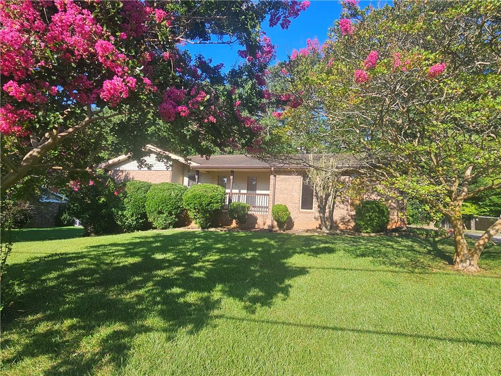 Gorgeous brick ranch home / partial finished basement / great location. This is a wonderful brick ranch style home in a great neighborhood with great schools and close to everything. Just minutes from Arbor Place Mall. This is a super large home with 3 bedrooms and 2 baths on the main floor and an additional media room with a fireplace downstairs. Home has a wonderful spacious living room with door leading out to huge sunroom overlooking private fenced back yard. There is also another super large family room / dining room on the front side of home with large picture windows offering natural lighting. This is great for entertaining. That's right, this home has 2 living rooms. Both super spacious with plenty of room to entertain.
This home offers an eat-in kitchen with country pine cabinets and plenty of counter space too. There is a pass-through window near the stove so you can easily entertain while cooking. There is also a window over the kitchen sink with a great view of the backyard. There is room for a small breakfast table too.
The laundry room is just off the kitchen which is a great location not to disturb others watching tv or entertaining guests. Enjoy the large master bedroom with spacious walk-in closet and a great master bath. There are two additional secondary bedrooms with ample closets sharing a guest bathroom in the hall. One of the rooms is smaller due to the upgrade for stairway to finished basement.
There is also a partially finished basement with 2 extra rooms downstairs. An awesome room with an open bar - great for entertaining and an extra super large room with a fir place downstairs which would be great, as a bonus room or media room. There is plenty of room for a pool table and sitting area. This home offers large unfinished basement area too - great for a large shop and plenty of extra room for storage.
Plenty of room to park in 2 car carport and additional parking for guests. There is also a great shed in the back - great for lawn mower, tools and bicycles. Come enjoy the luxury of living in a wonderful established neighborhood with great schools too.