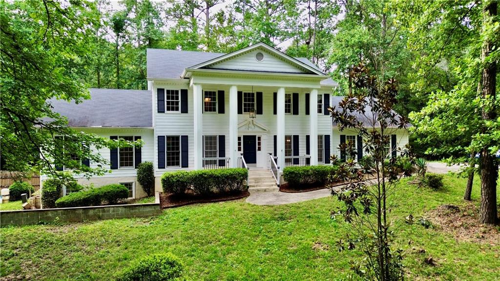 HIDDEN GEM in city of Lawrenceville: One of-a-kind white house resides on 1.33-acre lot in Brookwood High School district, NO HOA. 4 Bedrooms, 3.5 Bath, 2,861 sqft, NO CARPET!. Modern barn house style with Large Master suite on Main! Large deck and large patio! Immerse yourself in nature and peaceful views of Yellow River along the property line. 7 minutes to Brookwood High!! Enjoy your own getaway with Private Pool, Large Deck for any family gathering or party!! Located in flood zone AE with an annual flood insurance premium of $3,000+. Owning this one of a kind house is an opportunity you don't want to miss!!
