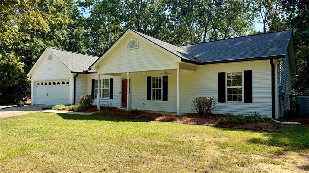 Great Location in Lula, GA! Conveniently located just minutes from Highway 985, this charming 3-bedroom, 2-bath home is perfect for commuters and offers the ideal blend of comfort and convenience. Step inside to an open floor plan with vaulted ceilings that create a spacious and airy feel. The kitchen and living areas flow seamlessly-perfect for entertaining or relaxing with family. The master bedroom features its own en suite bathroom, providing a private retreat. Two additional bedrooms and a full bath are ideal for children, guests, or a home office.Enjoy peace of mind with a fully fenced backyard-perfect for kids to play safely or for your furry friends to roam freely. A dedicated laundry room adds extra functionality and a 2 car garage is a perfect addition. Whether you're a first-time homebuyer or looking to downsize, this home is a fantastic choice in a prime location. Don't miss out!